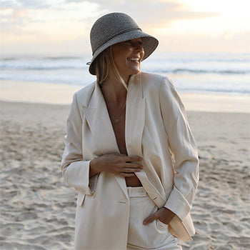 White hat shop beach